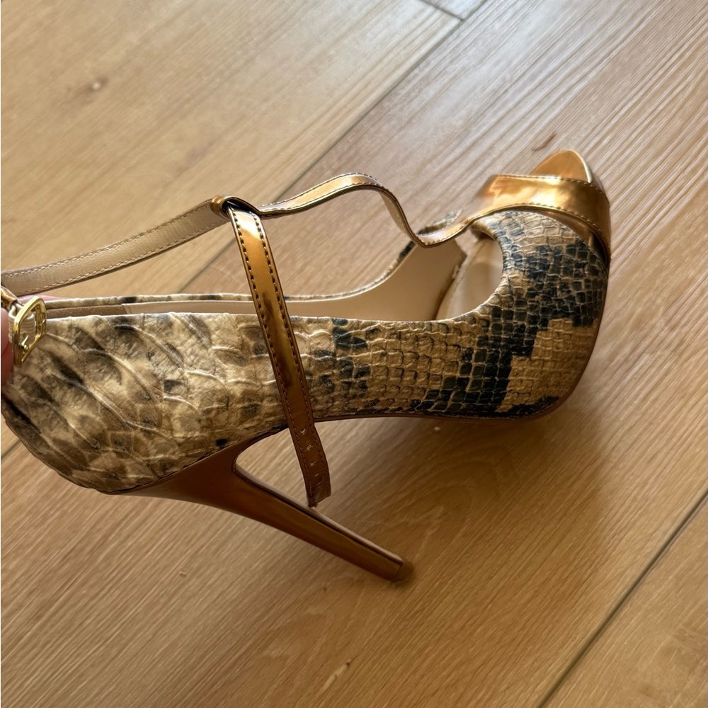 Aldo "Vanlerie" snake print and gold peep toe heels.